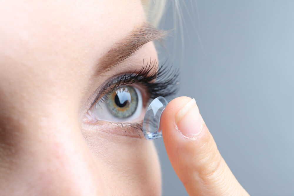 young woman with contact lens